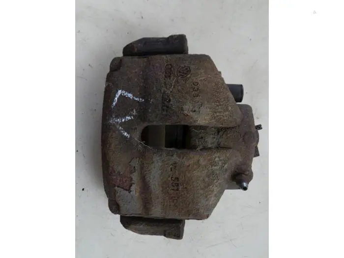 Front brake calliper, left Volkswagen Caddy