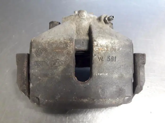 Front brake calliper, left Volkswagen Caddy